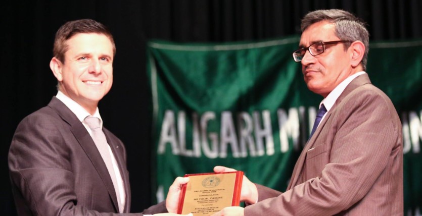Crescent Wealth CEO Talal Yassiene receiving award