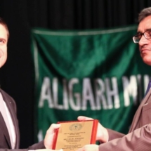 Crescent Wealth CEO Talal Yassiene receiving award